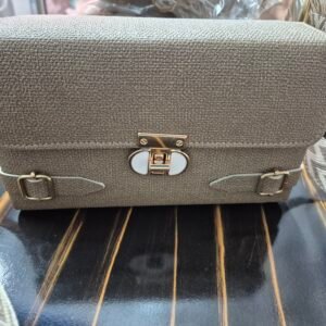 classic textured sling bag with broad belt – elegant
